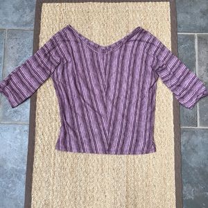 Purple striped top.